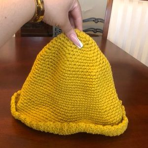 NWOT Free People Knitted Beanie in the color mustard yellow